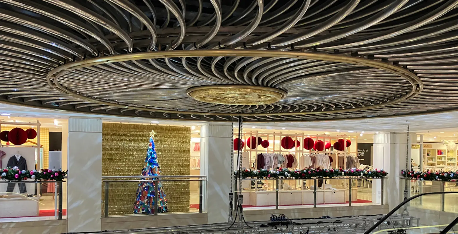 Circular ceiling air vent at Selfridges, London, made from arcs of stainless steel oval tube rolled by Timeless Tube in Poole, Dorset